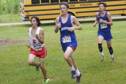 Senior Jonathan Arnold posted the best time among Jesuit's runners at the St. Paul's Christian Brothers Invitational on Sept. 16. Senior Michael Williams (in background) was the third Blue Jay to cross the finish line (Photo Courtesy Tiger Team).