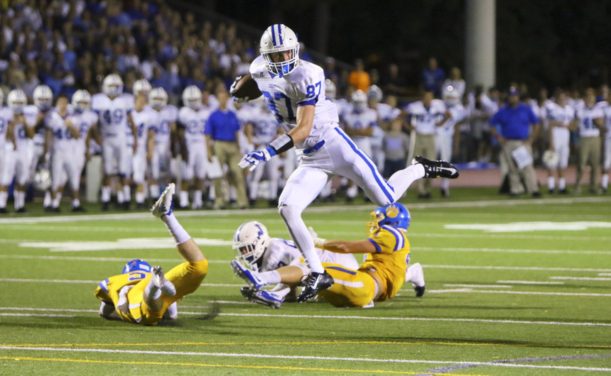 Senior tight end Drew Black clears the St. Paul's defender on a agile move to avoid the tackle.