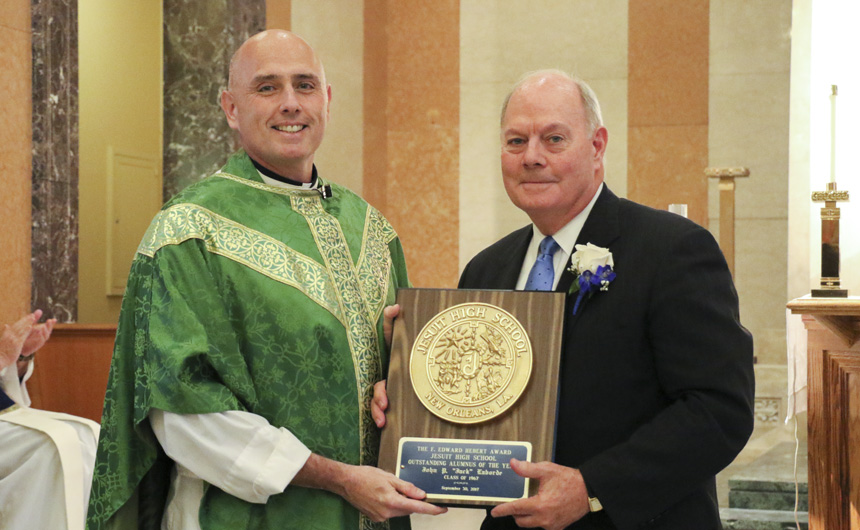 Fr. Fronk presents the Alumnus of the Year award to Jack Laborde '67.