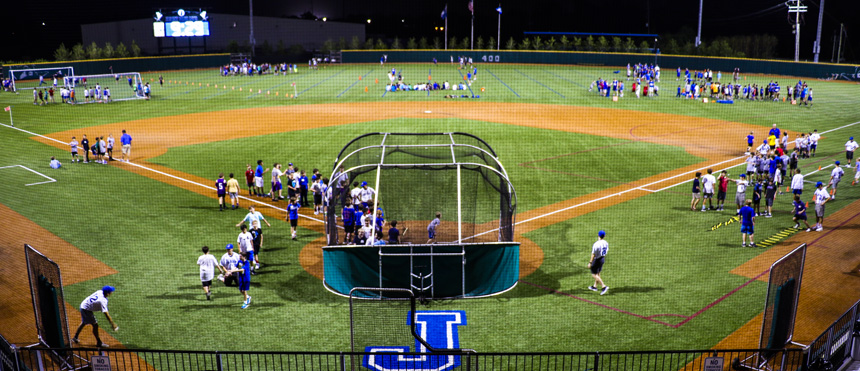 Boys in grades 4-8 rotated to and from various stations on Alumni Field at John Ryan Stadium. The baseball station took place at the infield and back-stop areas, soccer at the left field corner, rugby and cross country at left-centerfield, lacrosse at center field, football and frisbee at right field, and board games inside the food/drink shelter.