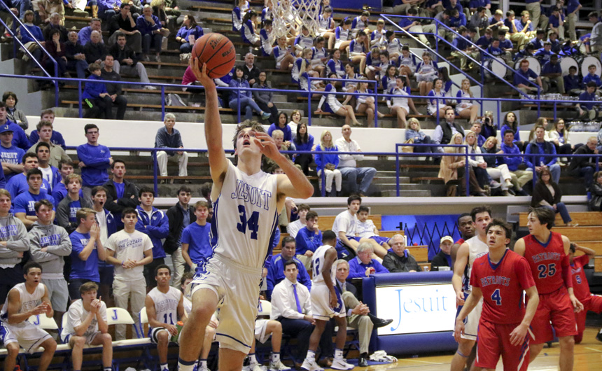 Senior Drew Black elevates to the basket to score two of his 17 points in the victory over John Curtis.