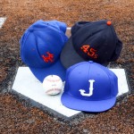 Rusty Staub's team hats on home plate at John Ryan Stadium