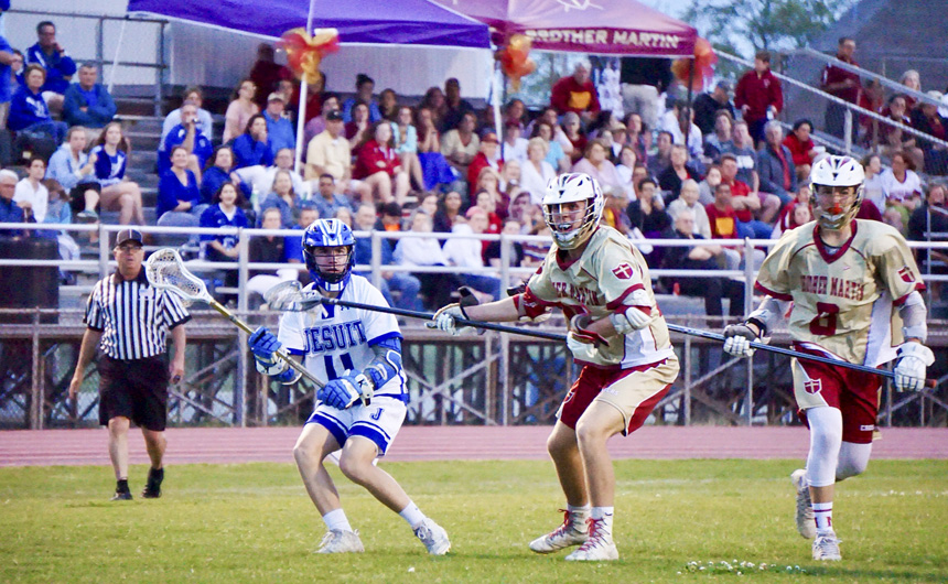 Sophomore Reed Wakefield facilitates the attacking front with a pass towards the goal. 