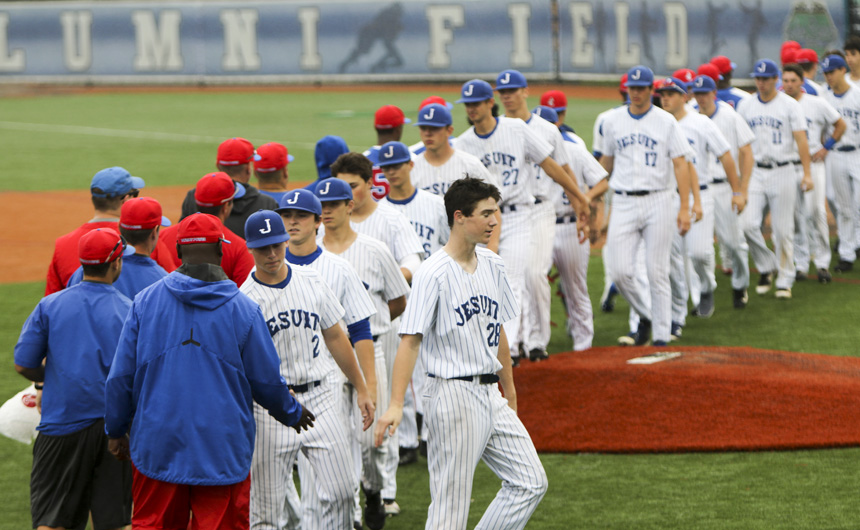 After a 13-inning game that lasted three hours and 10 minutes, Jesuit shakes hands with John Curtis, who won the game, 1-0.