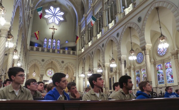 The vast ceiling looms high over the students as they listen to Mr. Reuther tell the history of the church.