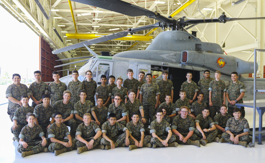 The MCJROTC cadets pose with a stationary training helicopter at the Marine Corps Air Station Camp Pendleton.