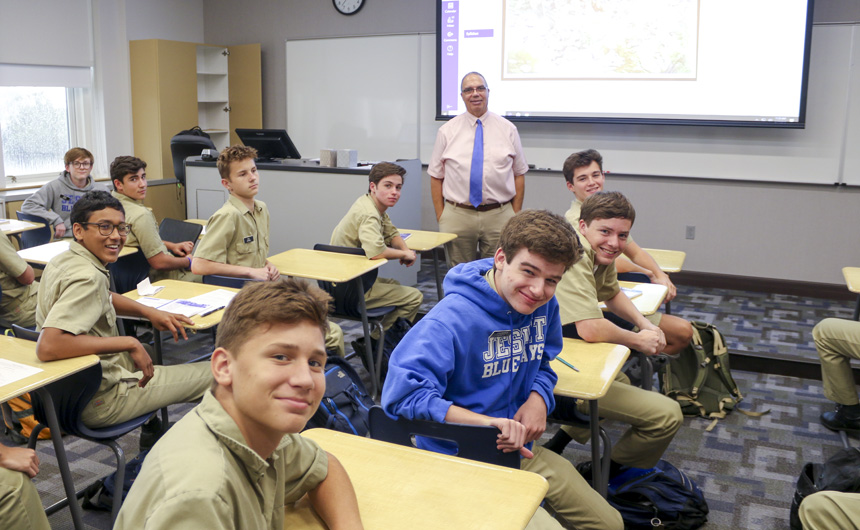 Mr. Christopher LaMothe and his theology students enjoy their first day together as a class.