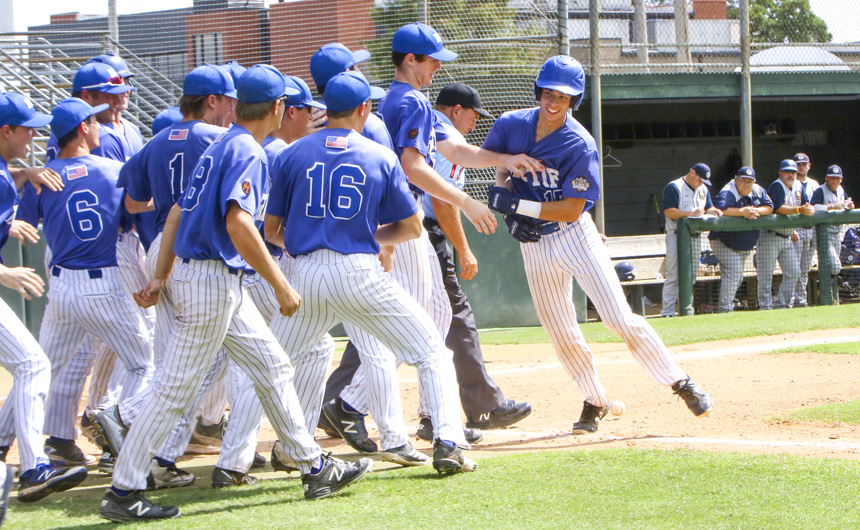 Catcher Parker Serio touches home plate and celebrates with the team after hitting a 3-run homer in the top of the third.